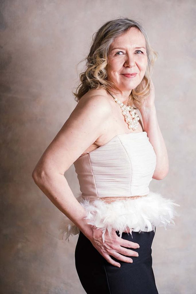 photoshoot-what-to-wear-mature-woman-glamour-beauty-portrait-dressed-in-feather-pencil-pink-black-dress-smiling-mayfair-london