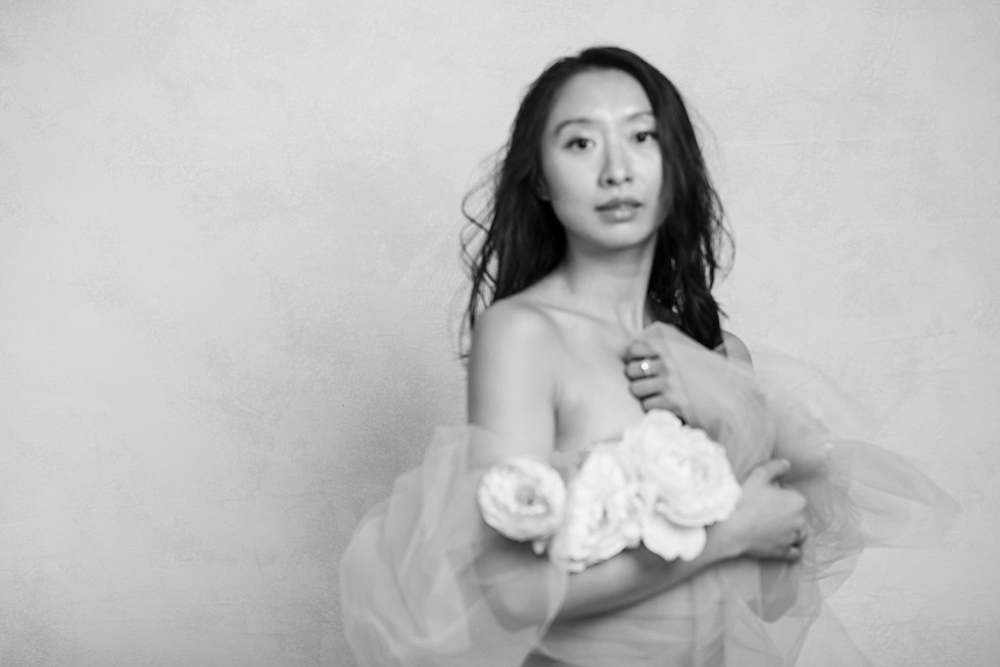 boudoir-photoshoot-london-Chinese-girl-wrapped-in-tulle-and-flowers-in-lieu-of-lingerie