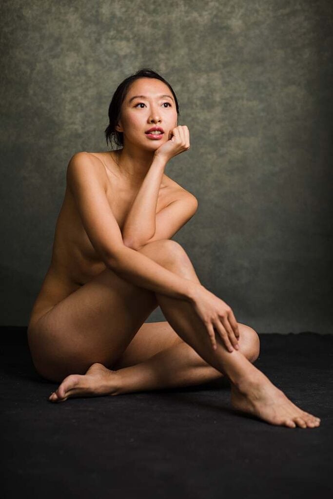 Fine art nude photography London - minimalist studio portrait showing natural beauty and confidence.