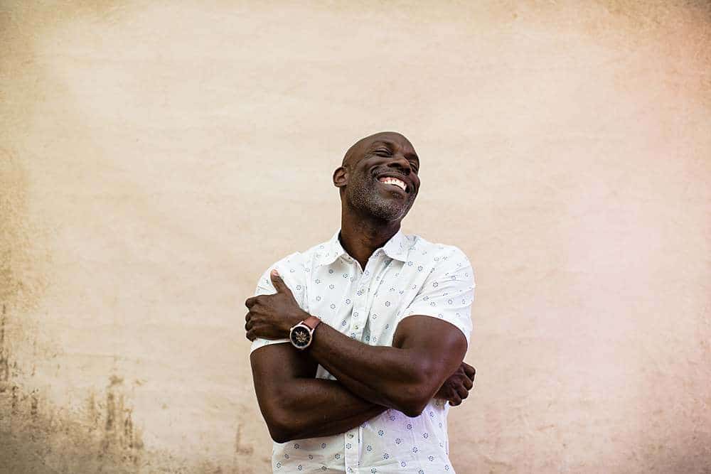 Personal-branding-photography-by-branding-photographer-london-of-african-american-man-laughing-in-joy