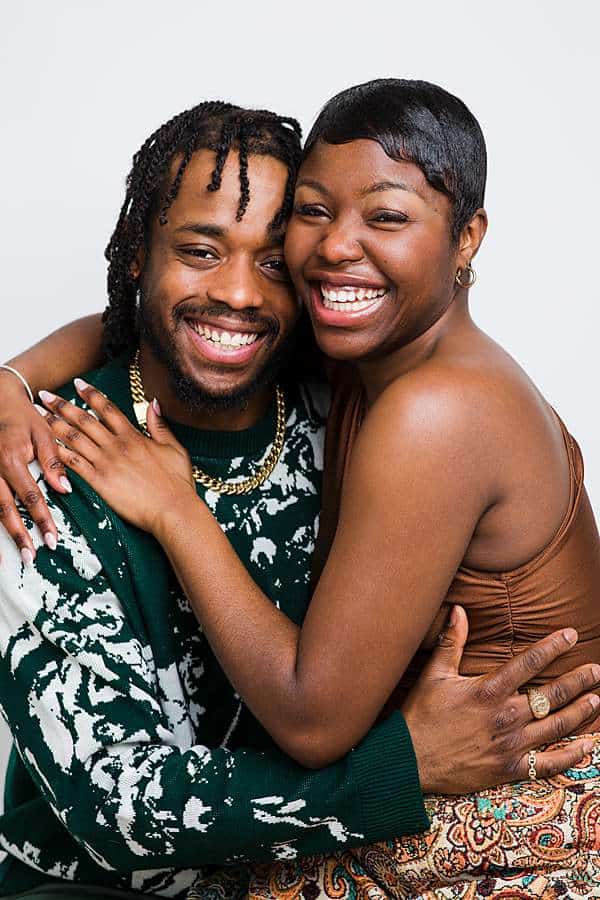 Happy couple embracing during anniversary portrait session in London studio