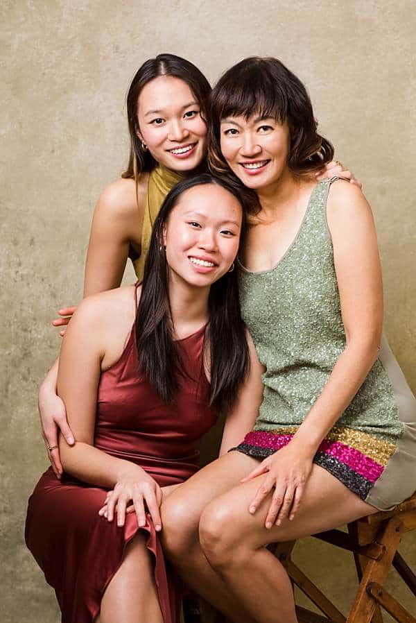 Mother with two adult daughters portrait in studio, elegant mother daughter photography London
